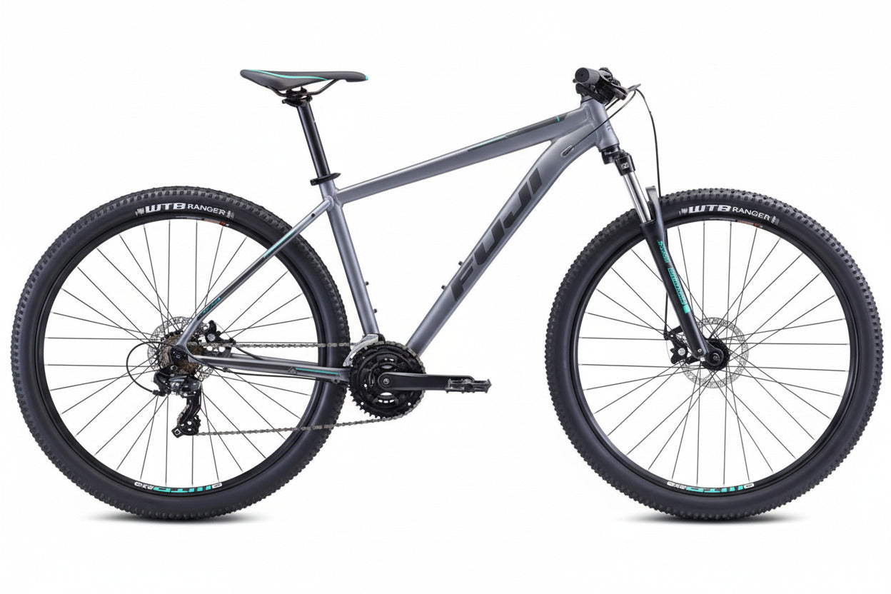 A Fuji Nevada 29 mountain bike in satin graphite color with black detailing, featuring a full suspension system and disc brakes.